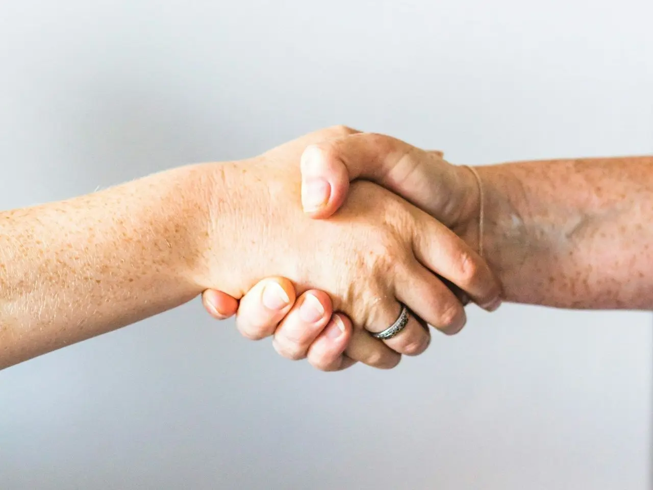 person holding hands of another person